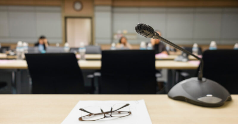 Photo of microphone in board room.